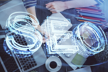 Multi exposure of woman's hands making notes with SEO icon. Concept of Search engine optimization