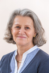 Smiling senior business woman. Isolated over white background looking to camera