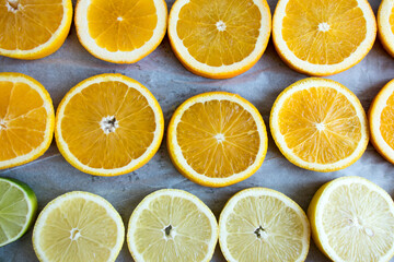 Fototapeta na wymiar Sliced orange,lemon ,lime. Citrus drying, top view, background, texture