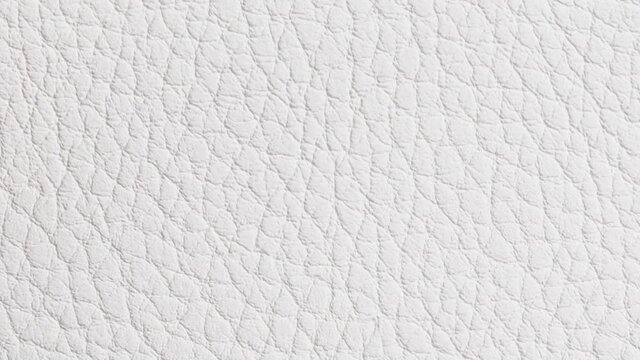 Rotating white leather background. View from above.