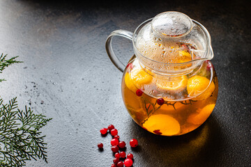 fruit tea teapot fresh fruits and berries citrus fruits, mint and other ingredients hot warming drink in a kettle on the table serving healthy meal top view copy space for text food background rustic