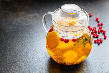 fruit tea teapot fresh fruits and berries citrus fruits, mint and other ingredients hot warming drink in a kettle on the table serving healthy meal top view copy space for text food background rustic