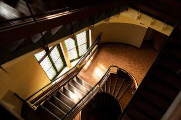 Fototapeta premium An interior of an old building with large stained glass windows