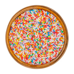 Rainbow sprinkles in a wooden bowl. Rod-shaped colorful sugar sprinkles. Tiny candies in a variety...