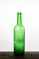 Bubbles in a green bottle on a white background