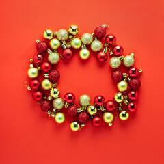 Red golden colorful Christmas tree decoration balls composition on red background