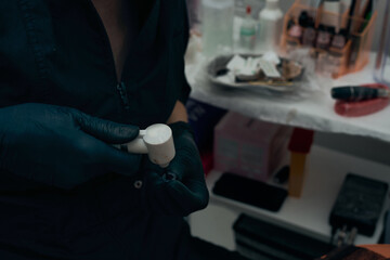 The process of preparing equipment and cosmetics for permanent eyebrow makeup. Make-up. The work of the master.