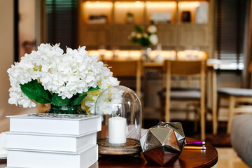 decoration of a table for guests. White candles in glass vases
