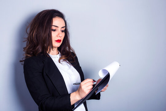 The Business Woman Holding Clipboard