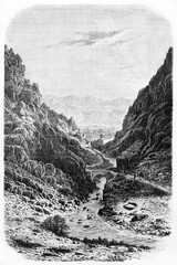 El Kantara gorge (The Mouth of the Desert) little bridge and river among high rocks in Biskra province, Algeria. Ancient grey tone etching style art by A. De Bar and Maurand on 1861
