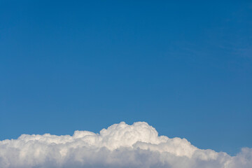 A blue sky with beautiful white clouds