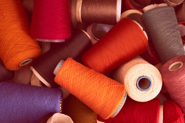 Composition of colorful vibrant wool threads from above. Autumn colours