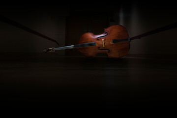 A double bass in a dark hall
