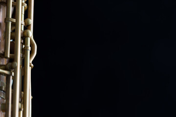 Vintage saxophone on a black background