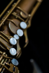 Fototapeta premium Vintage saxophone on a black background