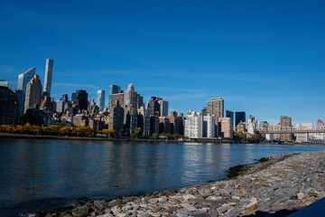 New York City Manhattan financial wall street district buildings skyline on a beautiful summer day with blue sky