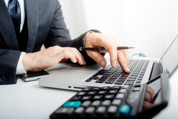 businesswoman hand using smart phone, tablet payments and holding credit card online shopping, omni channel, digital tablet docking keyboard computer at office in sun light