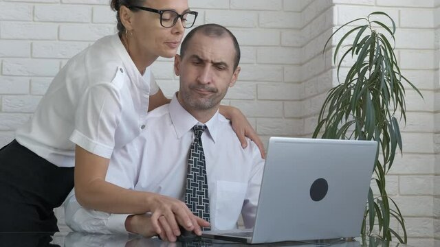 Love affair in the office. A man negate a woman's passion and flirt on the workplace.