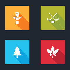 Set Canadian totem pole, Ice hockey sticks and puck, Christmas tree and maple leaf icon. Vector.