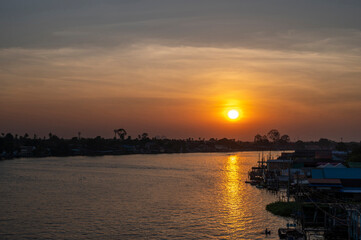 Beautiful Sunset View of Koh Kred at Rama IV bridge cross the Chao Phraya River in Park Kred, Nonthaburi province, Thailand