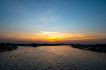 Beautiful Sunset View of Koh Kred at Rama IV bridge cross the Chao Phraya River in Park Kred, Nonthaburi province, Thailand