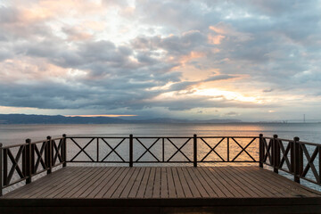 View of wooden railing and viewing terrace at the seaside