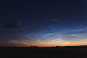 Fototapeta na wymiar blue night sky with Noctilucent clouds night shining clouds