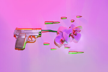 The golden gun shoots an orchid flower, next to fly bullets on a pink background, the concept against the war