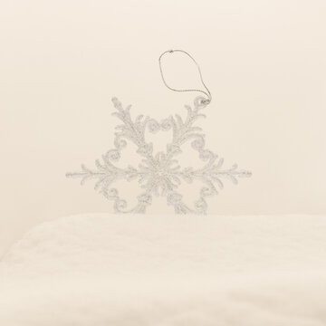 new year Christmas tree decoration in the form of snowflakes in a snowdrift mindal color