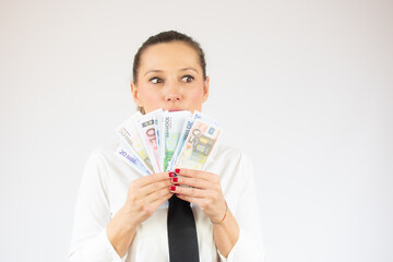 Photo of pretty cheerful business woman standing isolated over white background holding money.