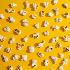 Random popcorns over a yellow background