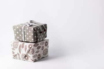 Christmas zero waste, environmentally friendly packaging of gifts in fabrics with natural composition, the concept of an eco-friendly Christmas holiday, minimalism. Christmas new year concept