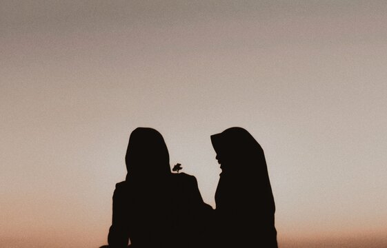 Silhouette Female Friends Against Clear Sky During Sunset