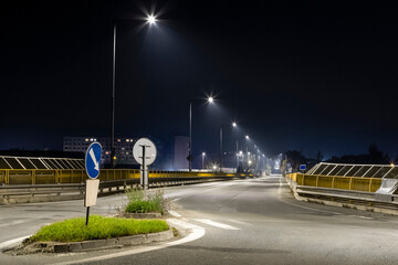 entrance to city, road bridge with modern LED illuminated at night