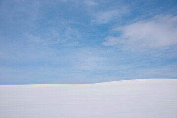 Fototapeta na wymiar Blue sky on a snowy landscape