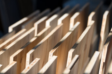 Samples of wooden furniture MDF profiles in sunlight. selective focus