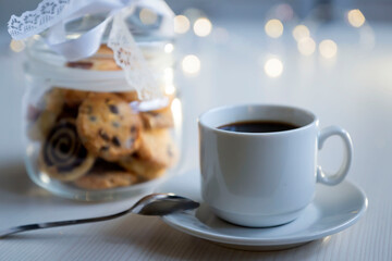 Coffee with cookies isolated on a white table.