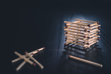 Stack of matches with multiple laid around