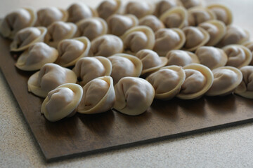 Cooking dumplings, ravioli on the table