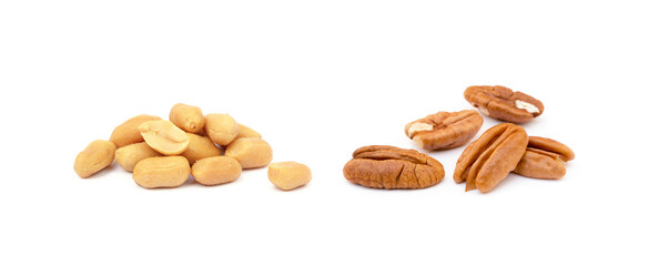Fresh pecan nuts and peanuts  isolated on a white background