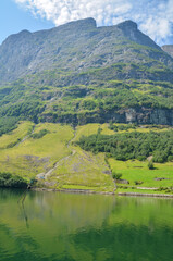Fototapeta na wymiar Beautiful fjord Sognefjord with rocky shores and turquoise water. Cruise around scandinavian beauty. Norway