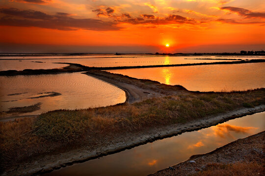THESSALONIKI PREFECTURE, MACEDONIA, GREECE. Sunset photo at the lagoon of Angelochori, a wetland about 30 km from the city of Thessaloniki.