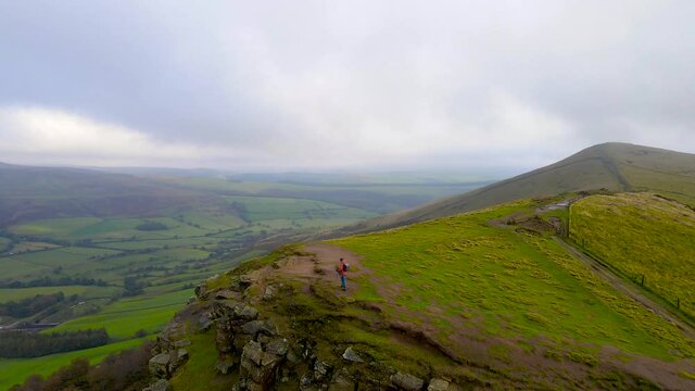 A photographer shooting in Peak District, an upland area in England at the southern end of the Pennines, UK