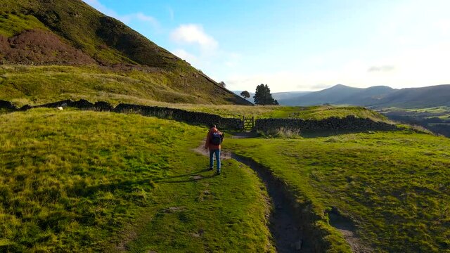 A photographer shooting in Peak District, an upland area in England at the southern end of the Pennines, UK
