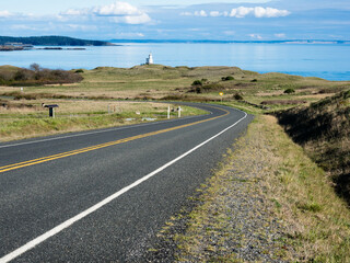 Scenic road leading to Cattle Point Lighthouse - San Juan Island, WA, USA