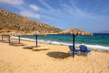 Obraz na płótnie Canvas Agia Theodoti beach with golden sand and azure waters on Ios Island. Cyclades, Greece