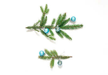 Christmas or New Year concept flat lay with blue festive balls and branches of fir. Top view. Copy space