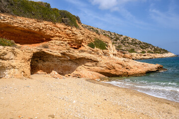 Amazing rock formations on sandy Theodoti beach on Ios Island. Cyclades, Greece