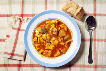 beef tripe stew with  red paprika named callos in spain , typical food