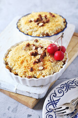 Apple crumble with almonds, two portions, red paradise apples dressing